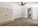 Large bedroom with a ceiling fan, carpet, and access to an ensuite bath at 1990 Freeman Ct, Henderson, NV 89014