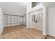 Bright home entryway featuring hardwood floors, built in shelves and double doors at 1990 Freeman Ct, Henderson, NV 89014
