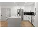 Bright kitchen with white cabinets, stainless appliances and a large center island at 1990 Freeman Ct, Henderson, NV 89014