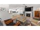 Comfortable living room with a fireplace and access to the bright, modern kitchen at 1990 Freeman Ct, Henderson, NV 89014