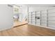 Spacious living room with built-in shelving, hardwood floors, and staircase at 1990 Freeman Ct, Henderson, NV 89014