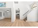 Open-concept living room leading to a modern kitchen and staircase at 1990 Freeman Ct, Henderson, NV 89014