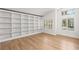 Bright room featuring a large built-in shelving unit and modern windows at 1990 Freeman Ct, Henderson, NV 89014