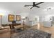 Inviting living room that opens to a kitchen with stainless appliances and a center island at 1990 Freeman Ct, Henderson, NV 89014