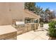 A covered outdoor kitchen boasts a built-in grill, countertop space, and stainless steel appliances perfect for entertaining at 1990 Freeman Ct, Henderson, NV 89014