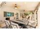 Inviting outdoor patio area with elegant furniture, ceiling fans, and a decorative ceiling at 1990 Freeman Ct, Henderson, NV 89014