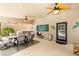 Inviting outdoor patio area with elegant furniture, ceiling fans, and outdoor access at 1990 Freeman Ct, Henderson, NV 89014