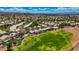 An extensive aerial view captures the sprawling golf course community and the city skyline in the distance at 2149 Eaglepath Cir, Henderson, NV 89074