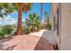 Charming backyard with patio, lush landscaping, and views of the golf course at 2149 Eaglepath Cir, Henderson, NV 89074