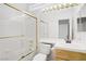 Bathroom with tile shower, modern sink, and vanity at 2149 Eaglepath Cir, Henderson, NV 89074