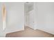 Unfurnished bedroom featuring a window with blinds, neutral carpeting, and a closet with sliding doors at 2149 Eaglepath Cir, Henderson, NV 89074