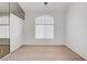 Bedroom featuring a closet and large window with blinds at 2149 Eaglepath Cir, Henderson, NV 89074