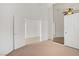 Bedroom with mirrored closet doors and connecting doors to another room at 2149 Eaglepath Cir, Henderson, NV 89074