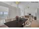 Spacious open-plan dining room with golf course views and modern furnishings at 2149 Eaglepath Cir, Henderson, NV 89074