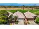 Charming single-story home boasts a well-manicured yard, mature trees, and a tile roof near a golf course at 2149 Eaglepath Cir, Henderson, NV 89074