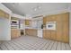 Spacious kitchen with tile floors, wooden cabinetry, and modern appliances at 2149 Eaglepath Cir, Henderson, NV 89074