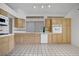 Spacious kitchen featuring a tile floor, tile countertops, and stainless steel appliances at 2149 Eaglepath Cir, Henderson, NV 89074