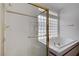 Main bathroom featuring a separate shower, a garden tub and a privacy block window at 2149 Eaglepath Cir, Henderson, NV 89074