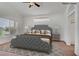 A virtually staged main bedroom featuring a large decorative bed frame and neutral colored walls at 2149 Eaglepath Cir, Henderson, NV 89074