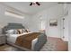 A virtually staged main bedroom with a view to the main bathroom at 2149 Eaglepath Cir, Henderson, NV 89074