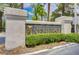 Elegant community sign surrounded by manicured landscaping and mature trees at 2149 Eaglepath Cir, Henderson, NV 89074