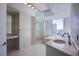 Bright bathroom features double sinks, soaking tub, glass enclosed shower, and city views at 222 Karen Ave # 2308, Las Vegas, NV 89109