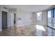 Bedroom with tile flooring, modern lighting, and city views at 222 Karen Ave # 2308, Las Vegas, NV 89109