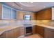 Modern kitchen with light wood cabinets, stone countertops, and stainless steel appliances at 222 Karen Ave # 2308, Las Vegas, NV 89109