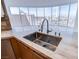 Close-up of modern kitchenette featuring stainless steel sink with luxurious marble countertops, panoramic city view at 222 Karen Ave # 2308, Las Vegas, NV 89109