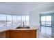 Modern kitchenette featuring stainless steel sink, marble countertops, and a stunning city view at 222 Karen Ave # 2308, Las Vegas, NV 89109