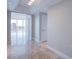 Open living space with tile floors, neutral paint and city view through a window at 222 Karen Ave # 2308, Las Vegas, NV 89109
