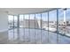 Bright, open living room boasts floor-to-ceiling windows showcasing a panoramic city view and marble floors at 222 Karen Ave # 2308, Las Vegas, NV 89109
