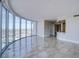Bright, open living room features floor-to-ceiling windows offering panoramic city views and an adjacent kitchenette at 222 Karen Ave # 2308, Las Vegas, NV 89109