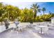Community outdoor kitchen with built-in grills, a bar, and dining tables for residents to enjoy at 222 Karen Ave # 2308, Las Vegas, NV 89109
