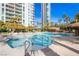 Beautiful community pool area surrounded by condos, palm trees and rock features at 222 Karen Ave # 2308, Las Vegas, NV 89109