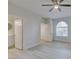 Bright bedroom with light wood-look floors and updated bathroom at 2251 Wigwam Pkwy # 716, Henderson, NV 89074