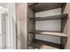 An open closet with multiple shelves for optimal storage and organization at 2407 Ridgeline Wash St, Las Vegas, NV 89138