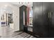 Walk-in closet featuring custom built in storage with window and access to bathroom at 2407 Ridgeline Wash St, Las Vegas, NV 89138