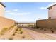 A brick driveway leads to a gate with views of the city in the distance at 2407 Ridgeline Wash St, Las Vegas, NV 89138