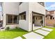 A modern exterior has a roll down awning and concrete pavers at 2407 Ridgeline Wash St, Las Vegas, NV 89138