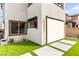 A modern exterior has a roll down awning and concrete pavers at 2407 Ridgeline Wash St, Las Vegas, NV 89138