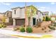 Attractive two-story home featuring a stone facade, two-car garage, desert landscaping and a corner lot at 2407 Ridgeline Wash St, Las Vegas, NV 89138