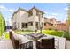 Outdoor seating area with modern furniture and manicured yard at 2407 Ridgeline Wash St, Las Vegas, NV 89138