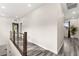 Second story hallway with wood floors leading to rooms with natural lighting at 2407 Ridgeline Wash St, Las Vegas, NV 89138