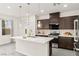 Modern kitchen with a center island, stainless steel appliances, and stylish pendant lighting at 2407 Ridgeline Wash St, Las Vegas, NV 89138