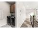 Laundry room featuring stainless steel washer and dryer, and built-in storage cabinets at 2407 Ridgeline Wash St, Las Vegas, NV 89138