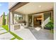 The covered patio features a full outdoor kitchen and a view inside at 2407 Ridgeline Wash St, Las Vegas, NV 89138