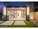 The patio features outdoor lighting, access to the backyard, and an outdoor kitchen sink and BBQ at 2407 Ridgeline Wash St, Las Vegas, NV 89138