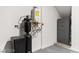A tankless water heater is next to a water softener system and a gun safe at 2407 Ridgeline Wash St, Las Vegas, NV 89138