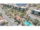 Aerial view of condo with a sparkling community pool and well-manicured landscaping at 2555 Hampton Rd # 7304, Henderson, NV 89052